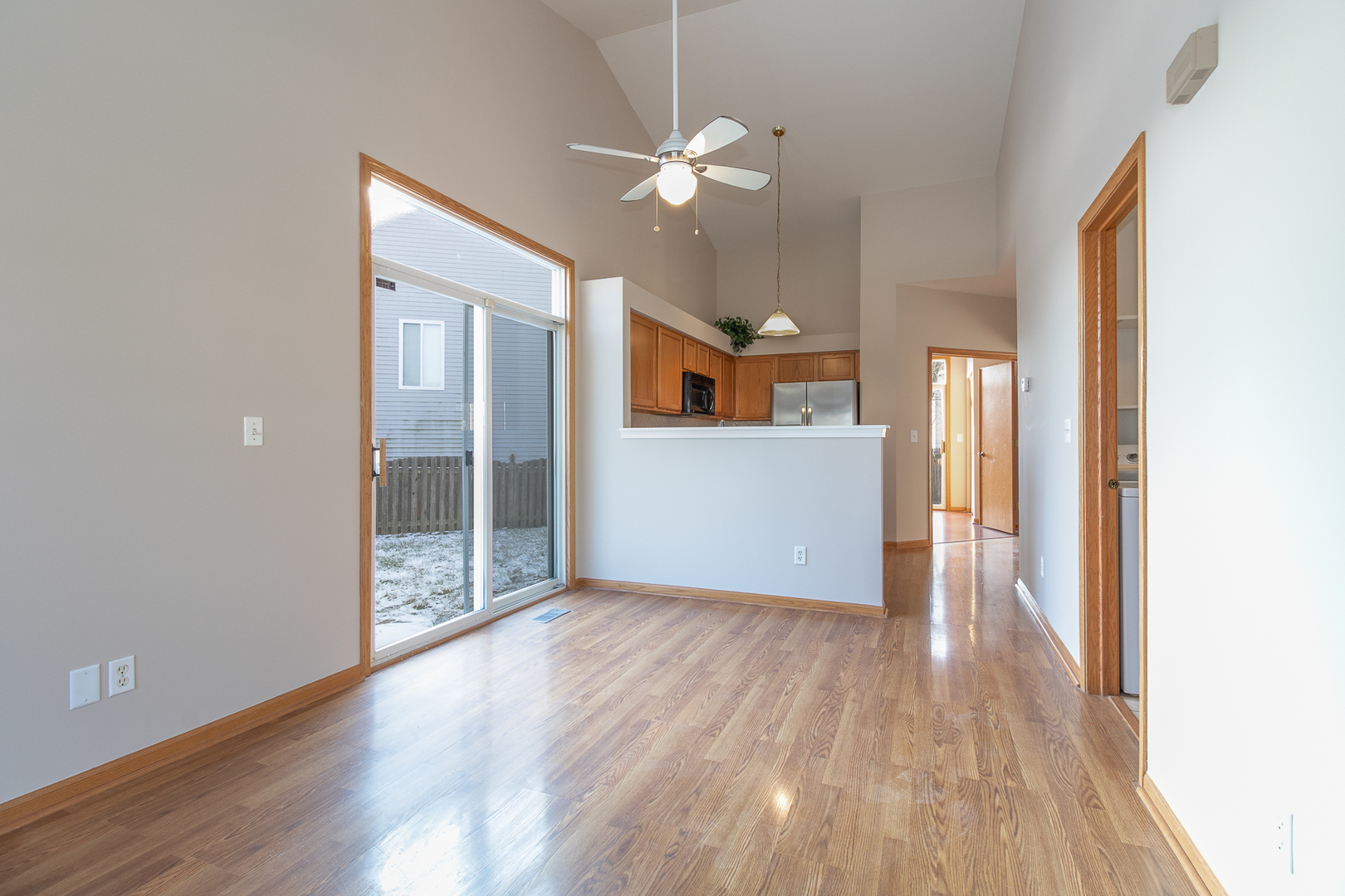 362 Reston Circle Romeoville, IL 60446 - Photo 3 of 15 wooden floor in an empty room with a window