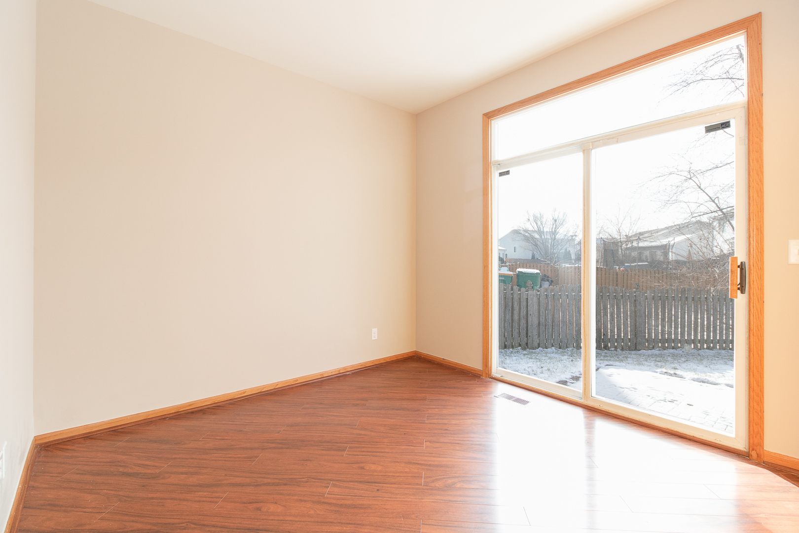 362 Reston Circle Romeoville, IL 60446 - Photo 8 of 15 a view of empty room with wooden floor and fan