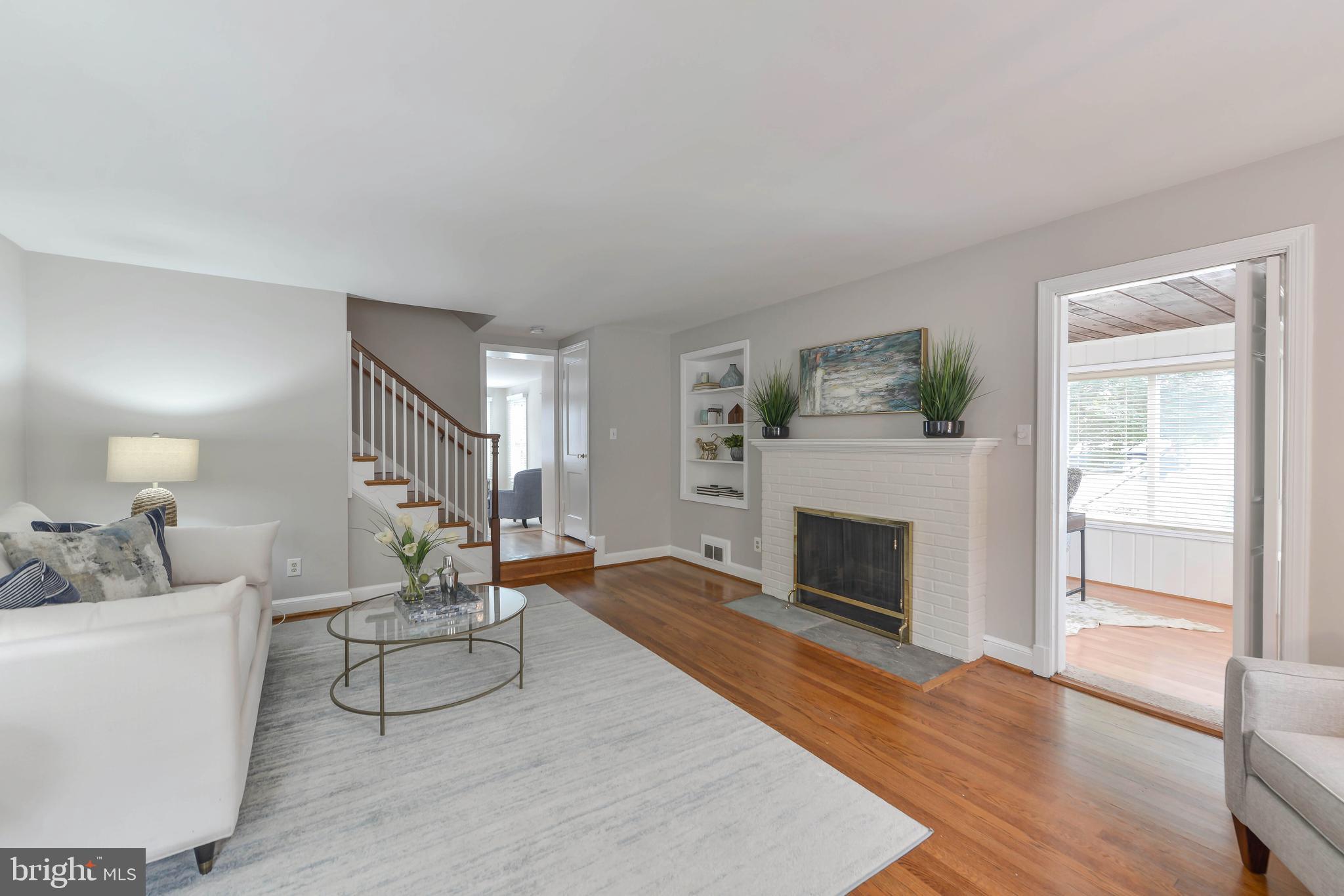 6484 Little Falls Road Arlington, VA 22213 - Photo 18 of 74 Spacious and bright living room with fireplace