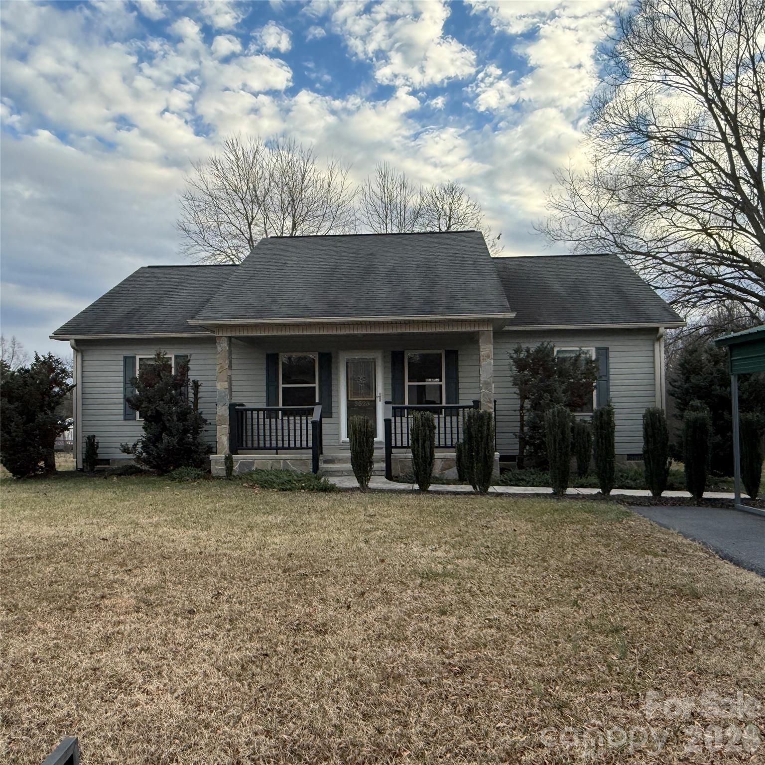 3523 Icard Rhodhiss Road Connelly Springs, NC 28612 - Photo 27 of 28 a front view of a house with a garden