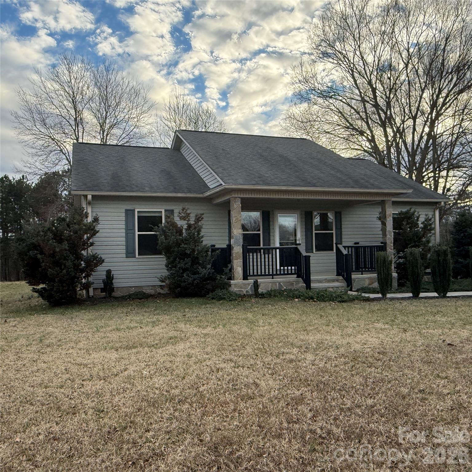 3523 Icard Rhodhiss Road Connelly Springs, NC 28612 - Photo 3 of 28 a view of a house with a yard and large tree