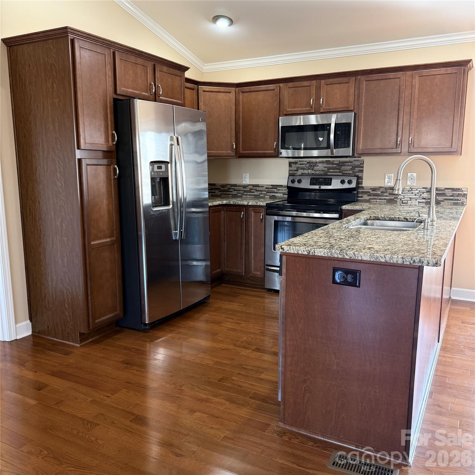 3523 Icard Rhodhiss Road Connelly Springs, NC 28612 - Photo 4 of 28 a kitchen with granite countertop a refrigerator and a sink