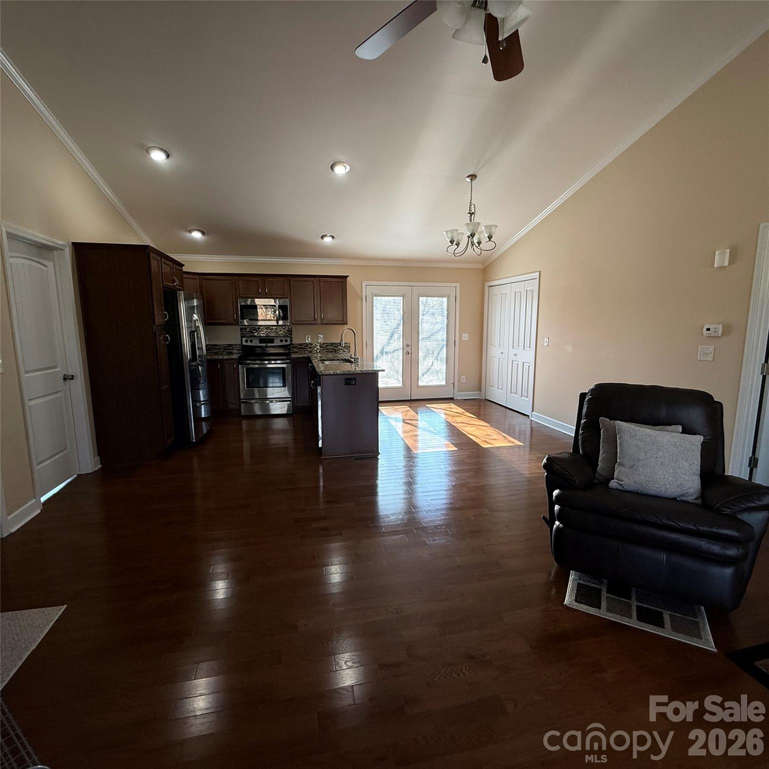 3523 Icard Rhodhiss Road Connelly Springs, NC 28612 - Photo 10 of 28 a view of kitchen with stainless steel appliances wooden floor and a view of living room