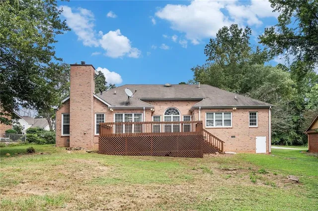 a view of deck with wooden floor and fence