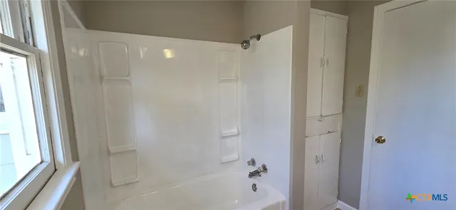 a bathroom with a bathtub