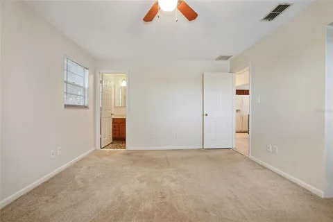a view of an empty room with a closet