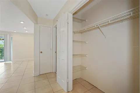 a view of storage and utility room with a window