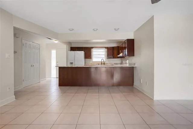 a kitchen with stainless steel appliances granite countertop a sink and cabinets