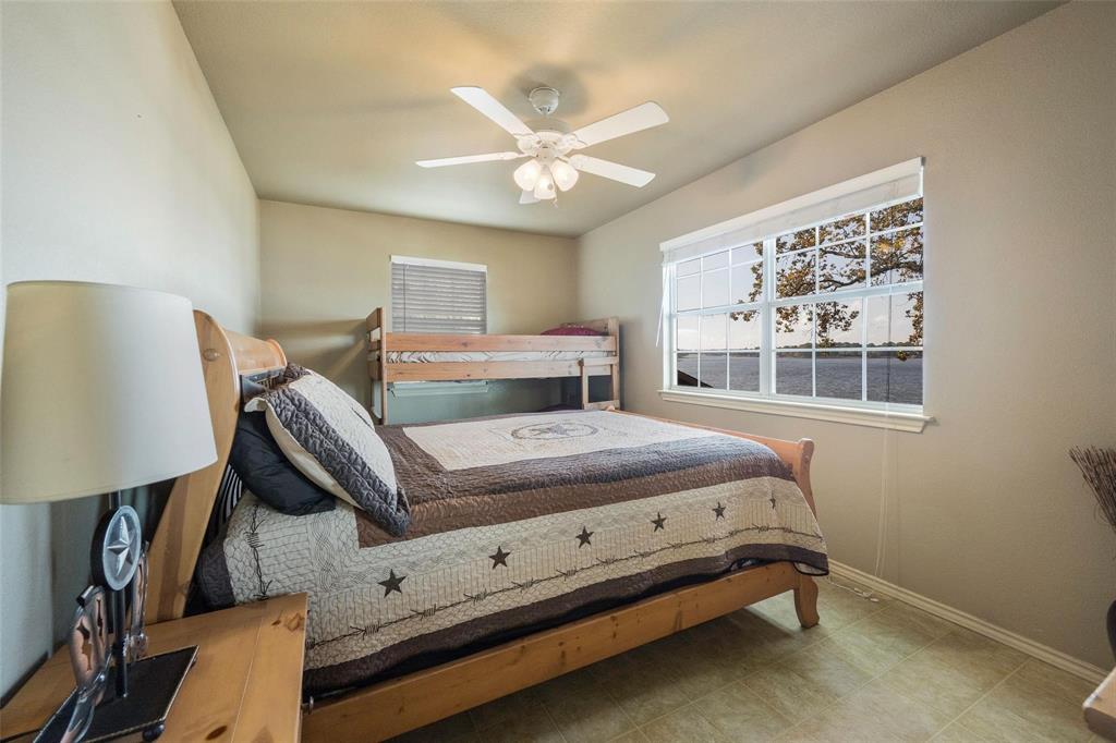 236 County Road 1422 Quitman, TX 75783 - Photo 14 of 34 Bedroom featuring ceiling fan and baseboards
