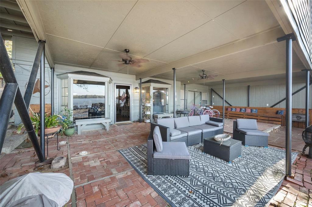 236 County Road 1422 Quitman, TX 75783 - Photo 23 of 34 View of patio featuring ceiling fan and an outdoor living space