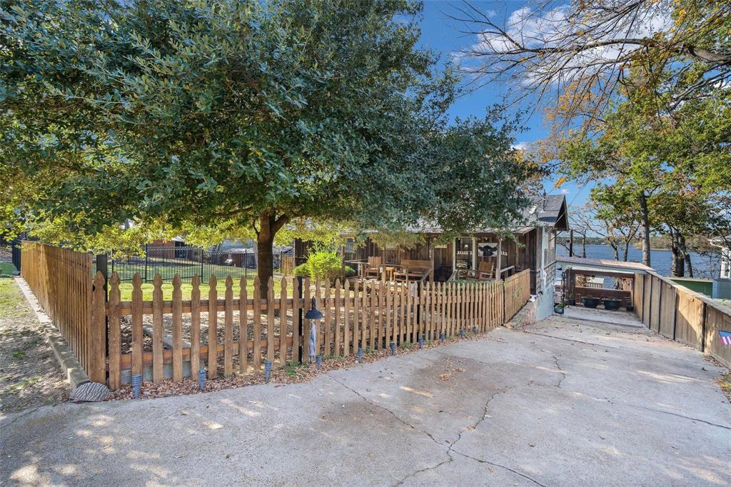 236 County Road 1422 Quitman, TX 75783 - Photo 3 of 34 View of front of property featuring a fenced front yard
