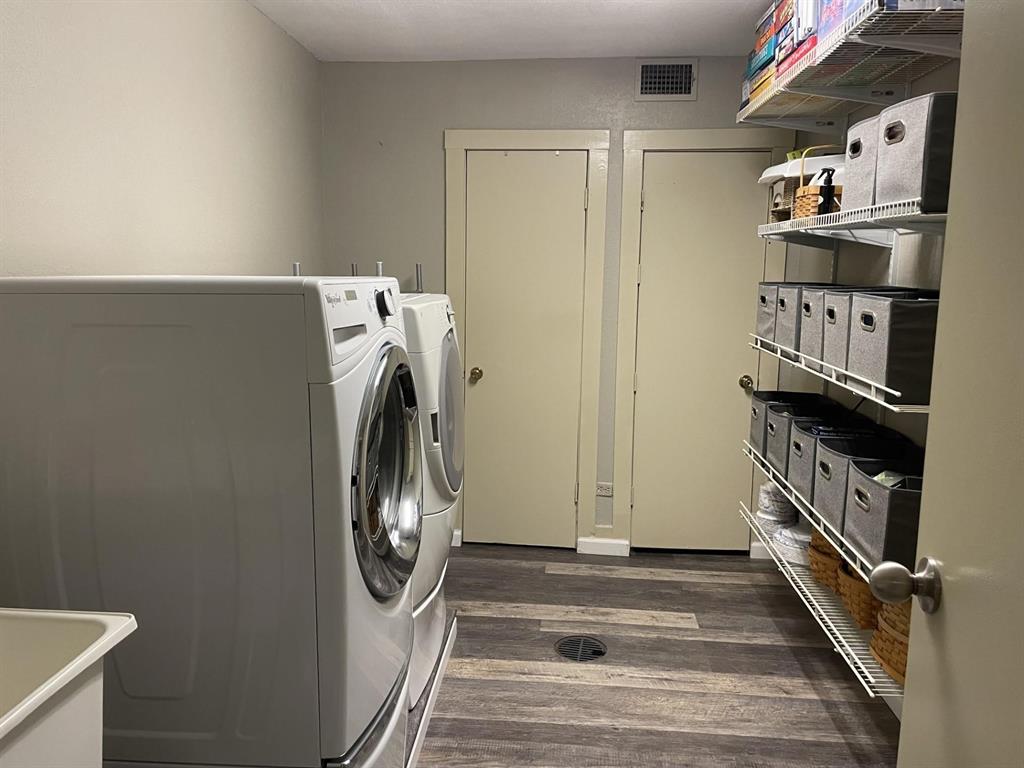 236 County Road 1422 Quitman, TX 75783 - Photo 34 of 34 Washroom with laundry area, visible vents, dark wood finished floors, and independent washer and dryer