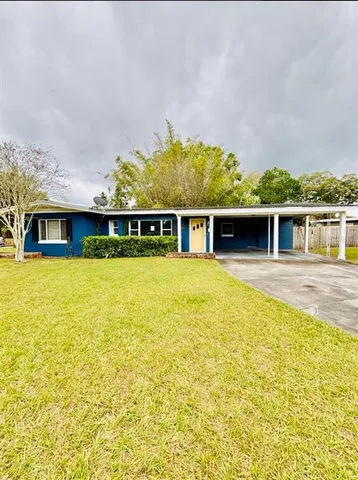 a view of house with swimming pool