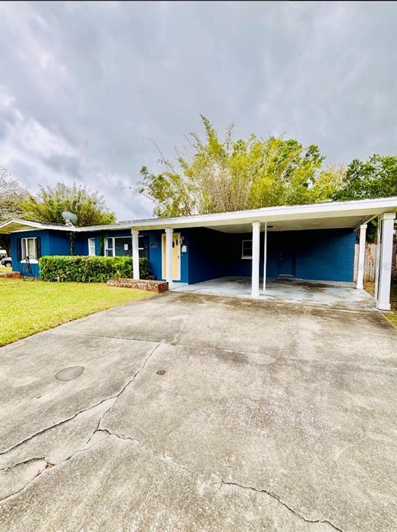 1202 Berwyn Road Orlando, FL 32806 - Photo 3 of 3 front view of a house with a yard