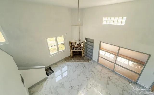 a view of livingroom with furniture and window