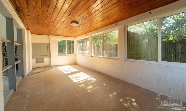 a view of a swimming pool with an outdoor space and seating area
