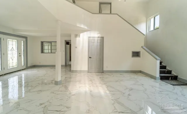 an entryway with a white walls