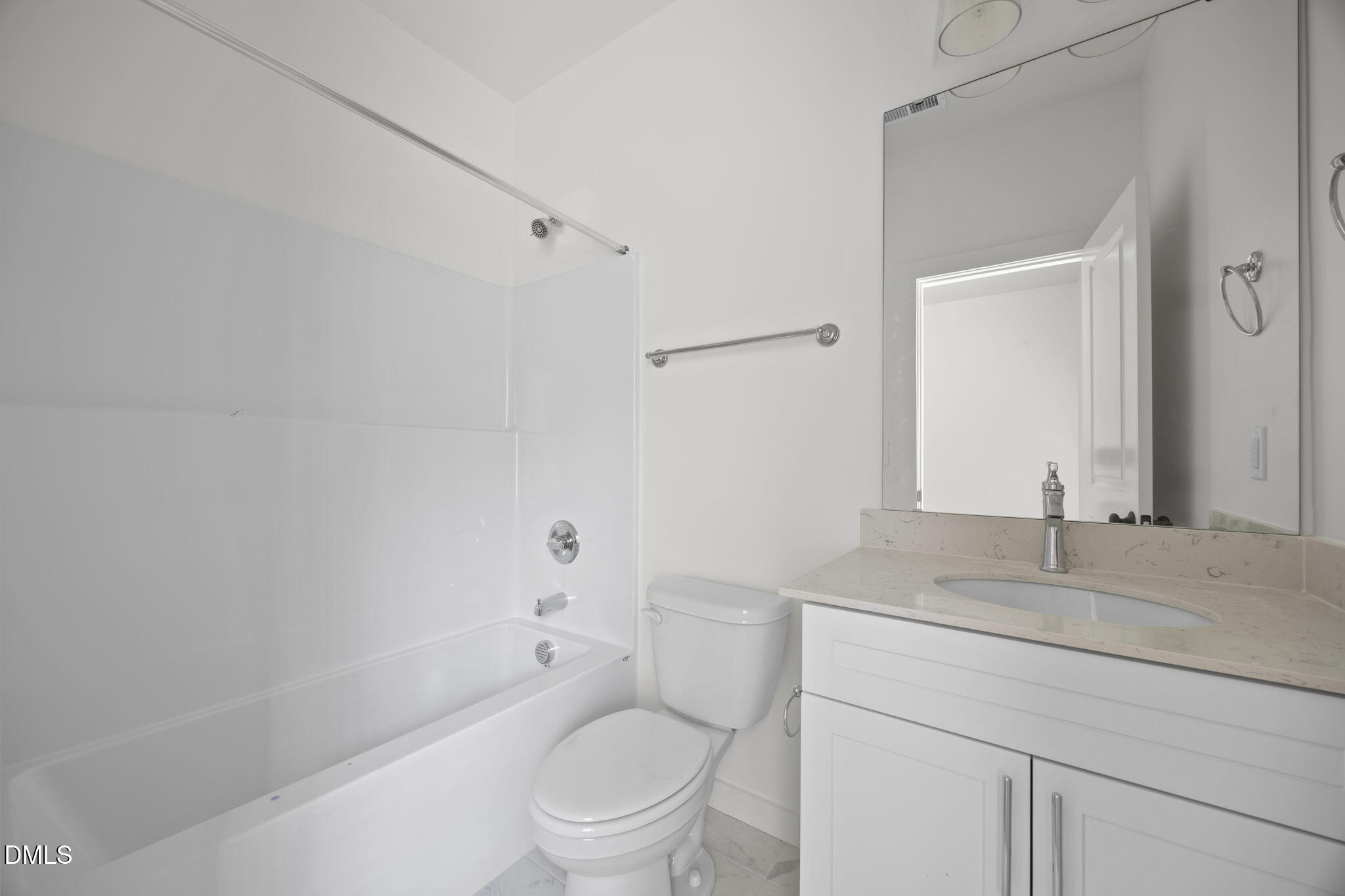 2811 Wilcox Place, Unit 101 Raleigh, NC 27607 - Photo 12 of 29 a bathroom with a toilet sink vanity and mirror