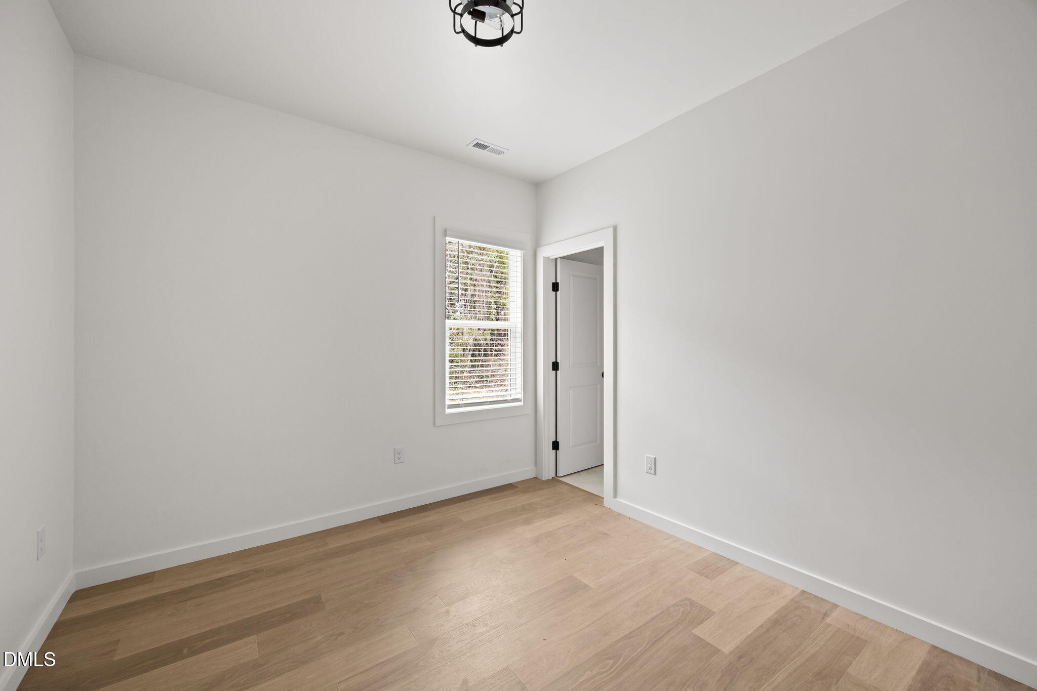 2811 Wilcox Place, Unit 101 Raleigh, NC 27607 - Photo 16 of 29 an empty room with windows