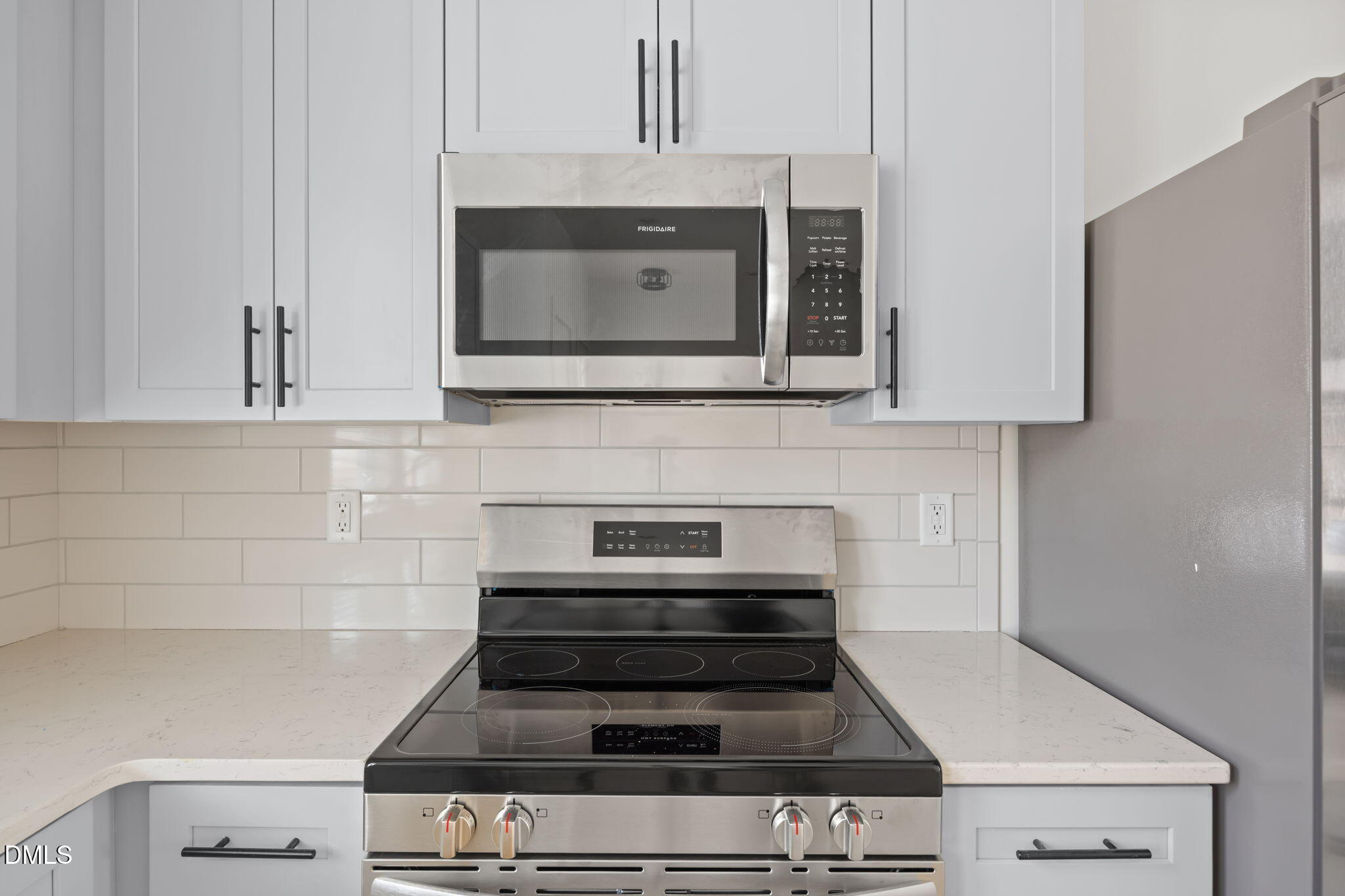 2811 Wilcox Place, Unit 101 Raleigh, NC 27607 - Photo 23 of 29 a stove top oven sitting inside of a kitchen