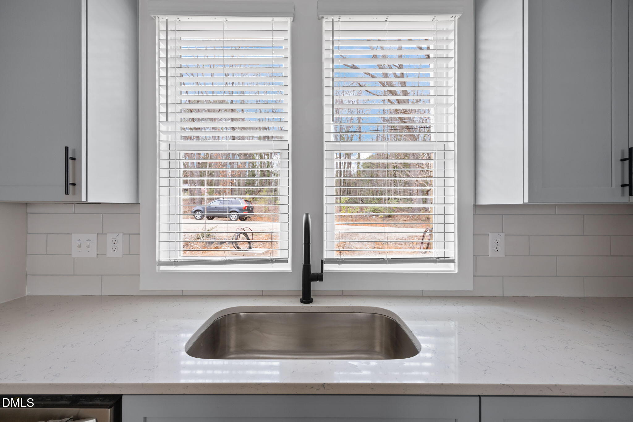 2811 Wilcox Place, Unit 101 Raleigh, NC 27607 - Photo 24 of 29 a close view of a sink and dishwasher with a window