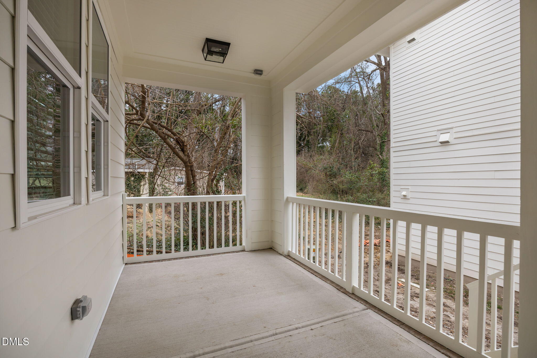 2811 Wilcox Place, Unit 101 Raleigh, NC 27607 - Photo 4 of 29 a view of a balcony with wooden floor and outdoor space