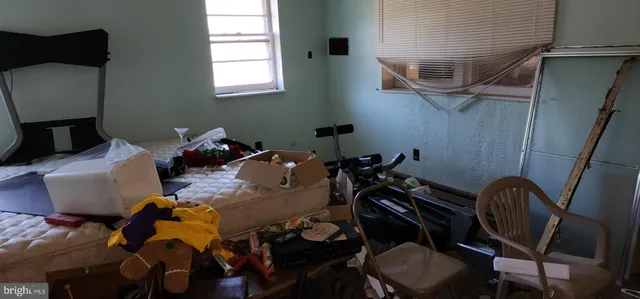 a view of a room with furniture and a window