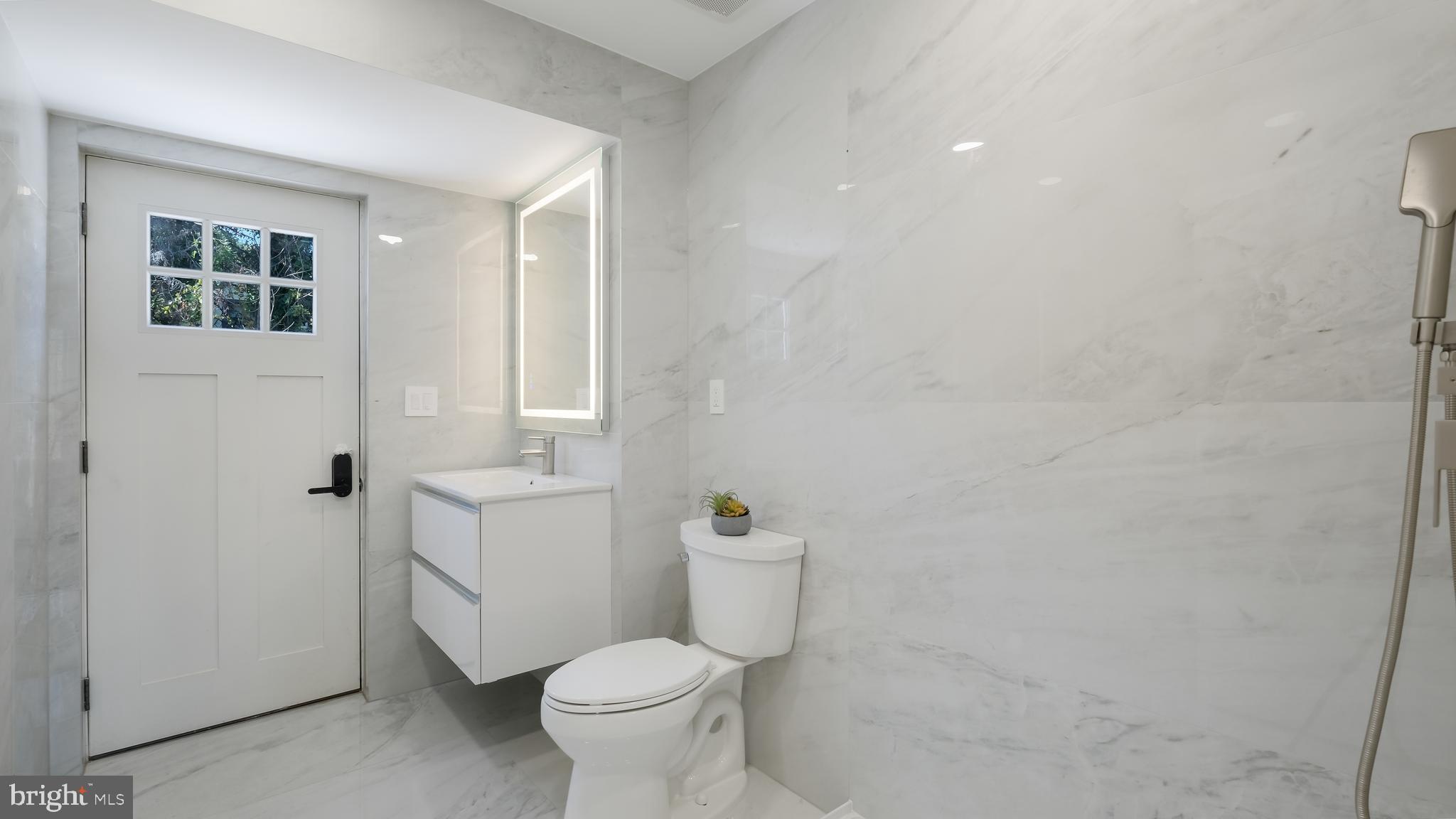 3750 Wheatsheaf Road Huntingdon Valley, PA 19006 - Photo 15 of 41 Full main floor bathroom w/door to backyard