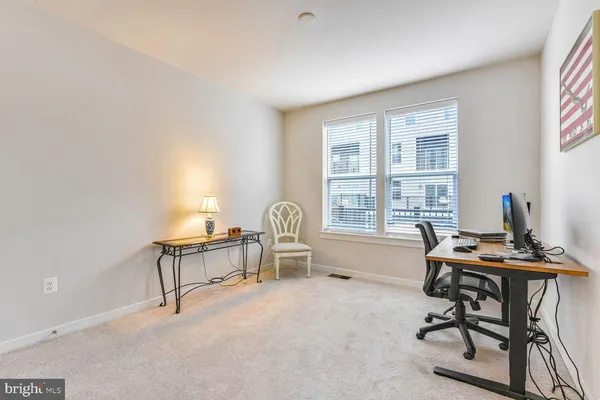 a workspace with furniture and a window