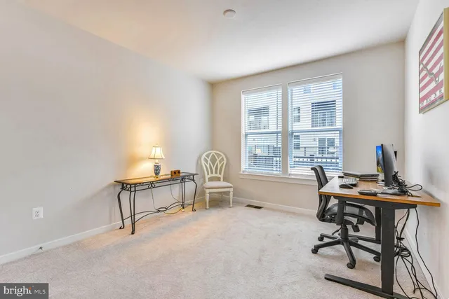 a workspace with furniture and a window