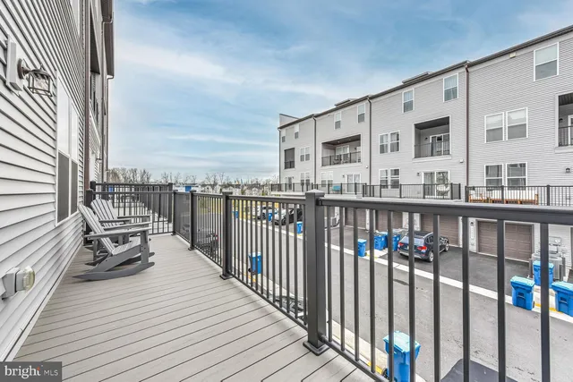 a balcony view with a iron stairs