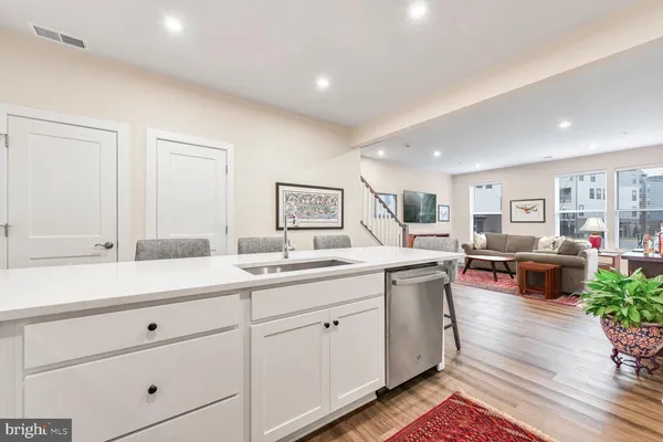 a kitchen with sink and cabinets