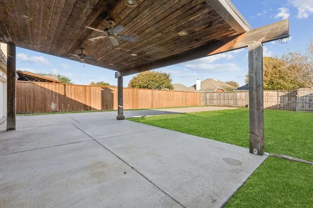 a view of a backyard with porch