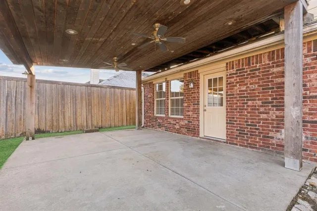 a view of an empty room with wooden walls