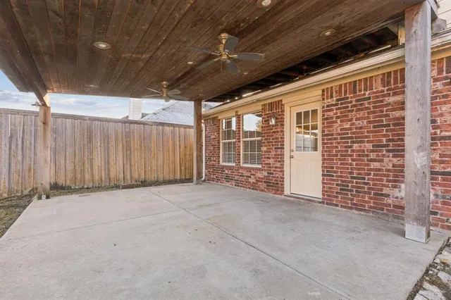 a view of an empty room with windows