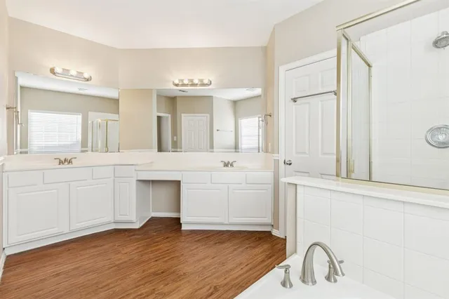 a bathroom with a sink vanity and mirror