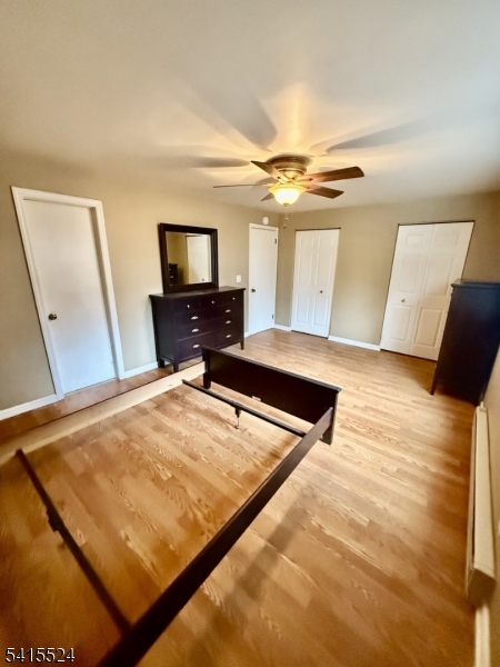 150 Karrville Road Port Murray, NJ 07865 - Photo 18 of 40 a bedroom with a bed and a flat screen tv