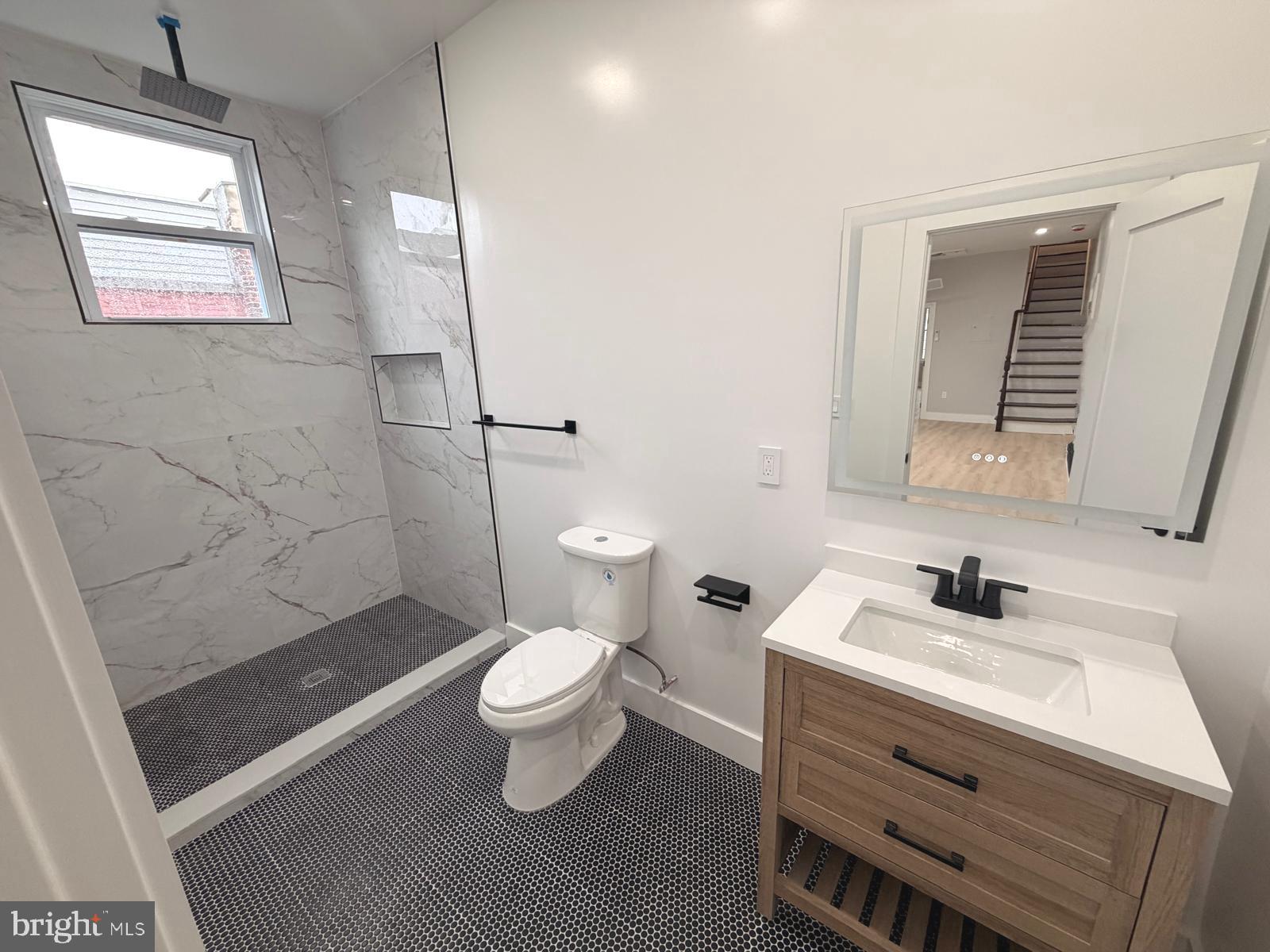 230 North 9th Street Reading, PA 19601 - Photo 8 of 20 a bathroom with a sink a toilet and shower