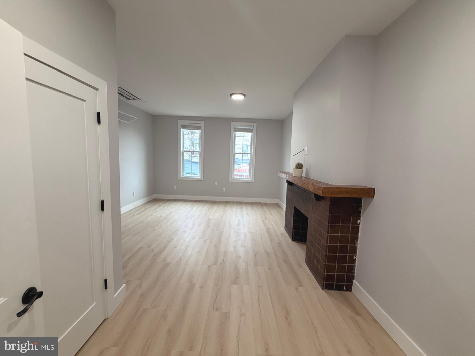 230 North 9th Street Reading, PA 19601 - Photo 10 of 20 wooden floor in an empty room with a window