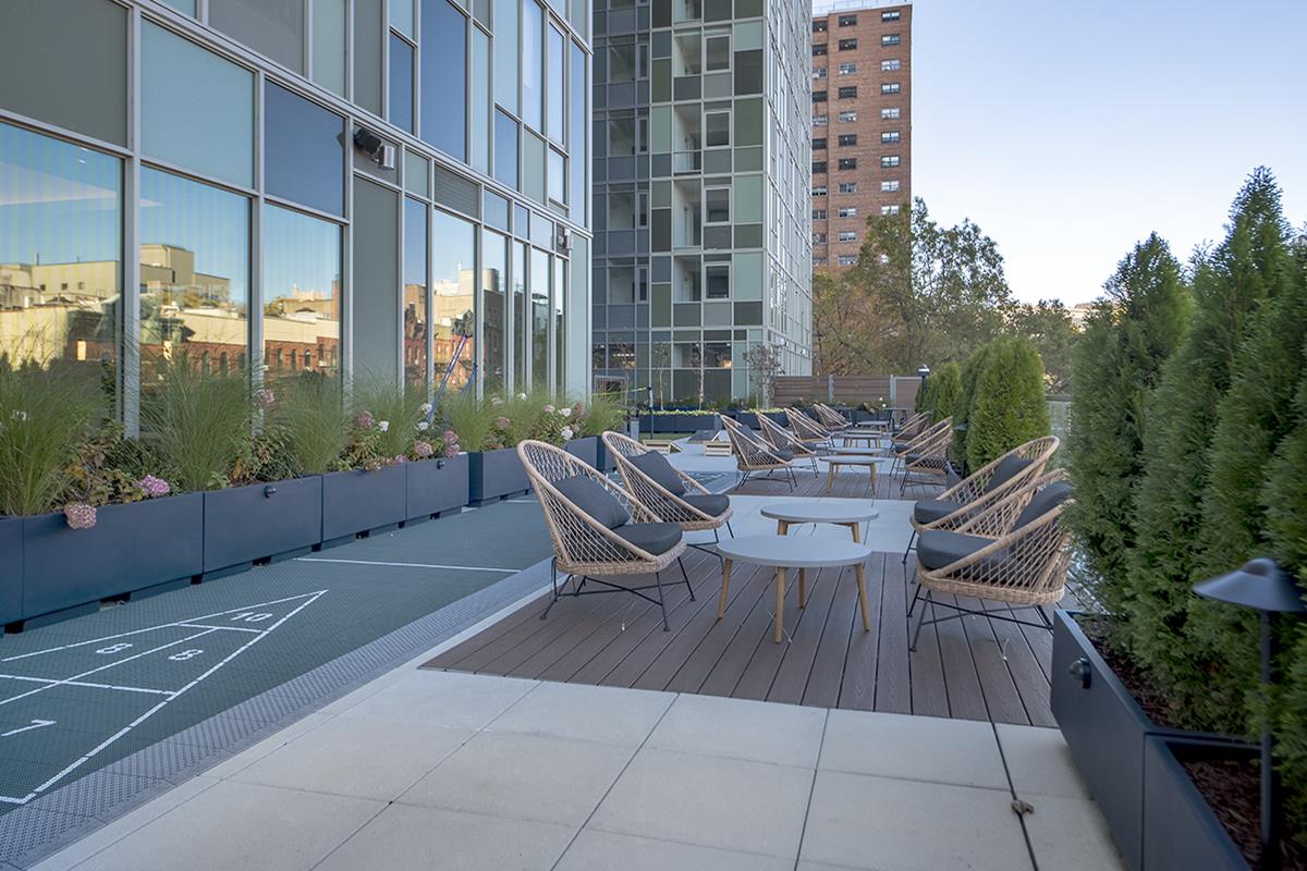 1440 Amsterdam Avenue, Unit 2022 Manhattan, NY 10027 - Photo 18 of 25 a view of a patio with a table chairs and backyard