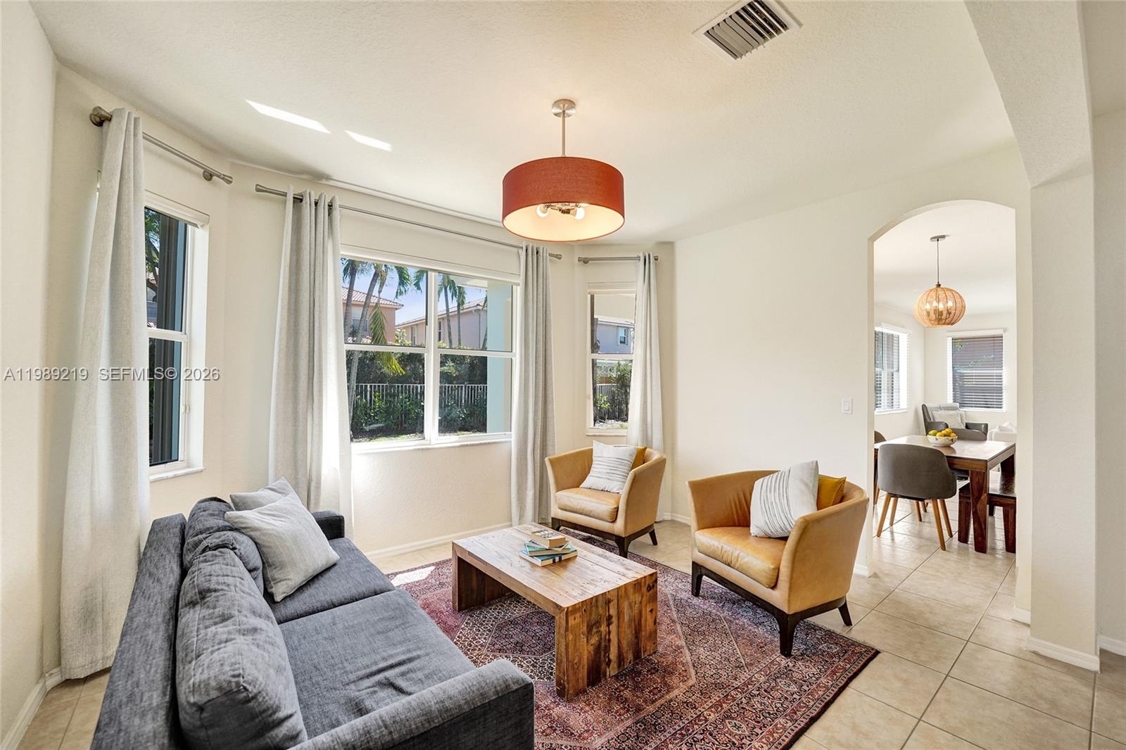 3936 Cascade Terrace Weston, FL 33332 - Photo 13 of 90 a living room with furniture and a window
