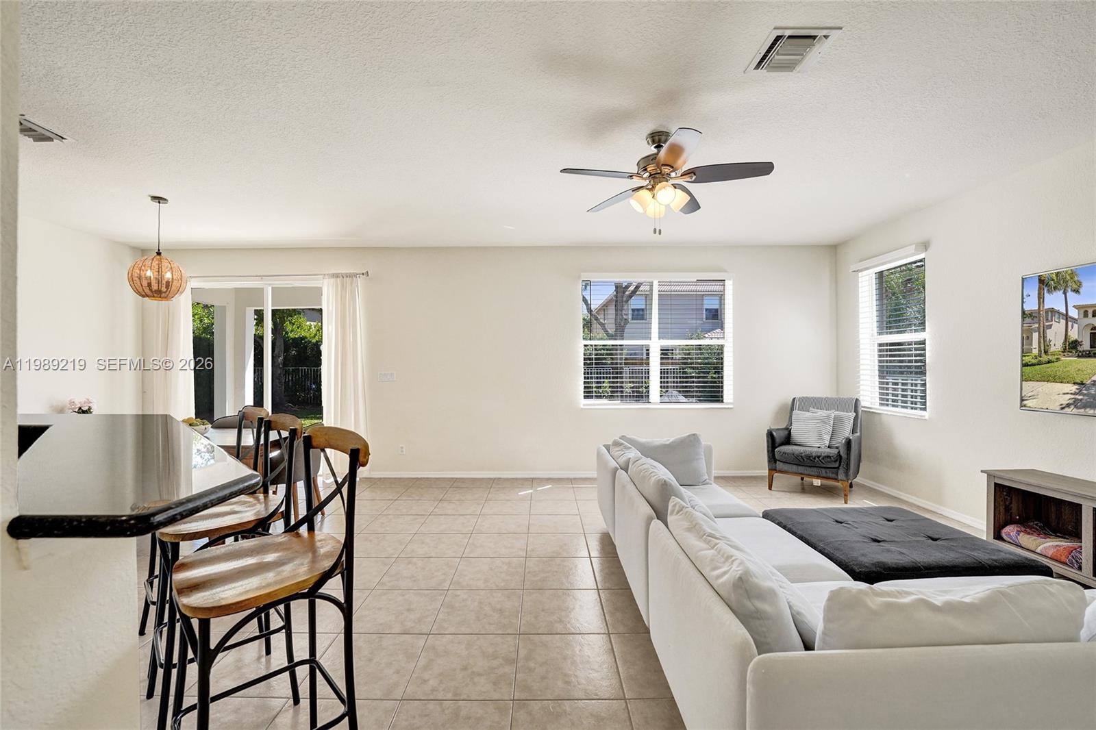 3936 Cascade Terrace Weston, FL 33332 - Photo 16 of 90 a living room with furniture and a window