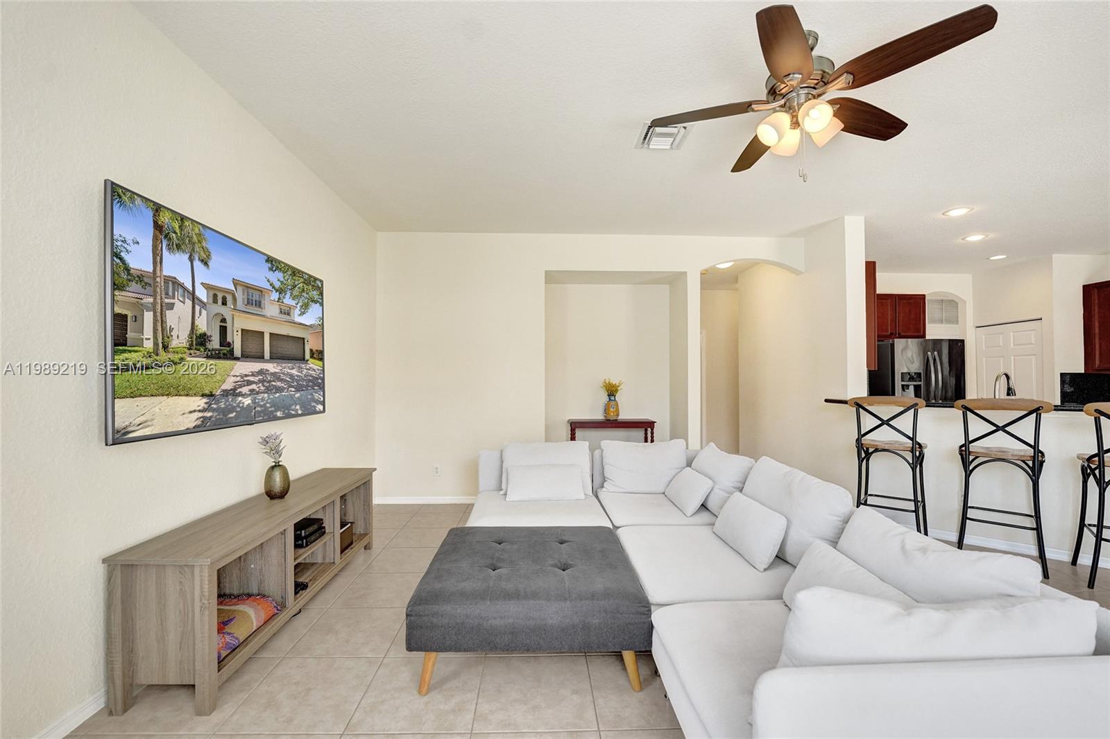 3936 Cascade Terrace Weston, FL 33332 - Photo 18 of 90 a living room with furniture and a ceiling fan