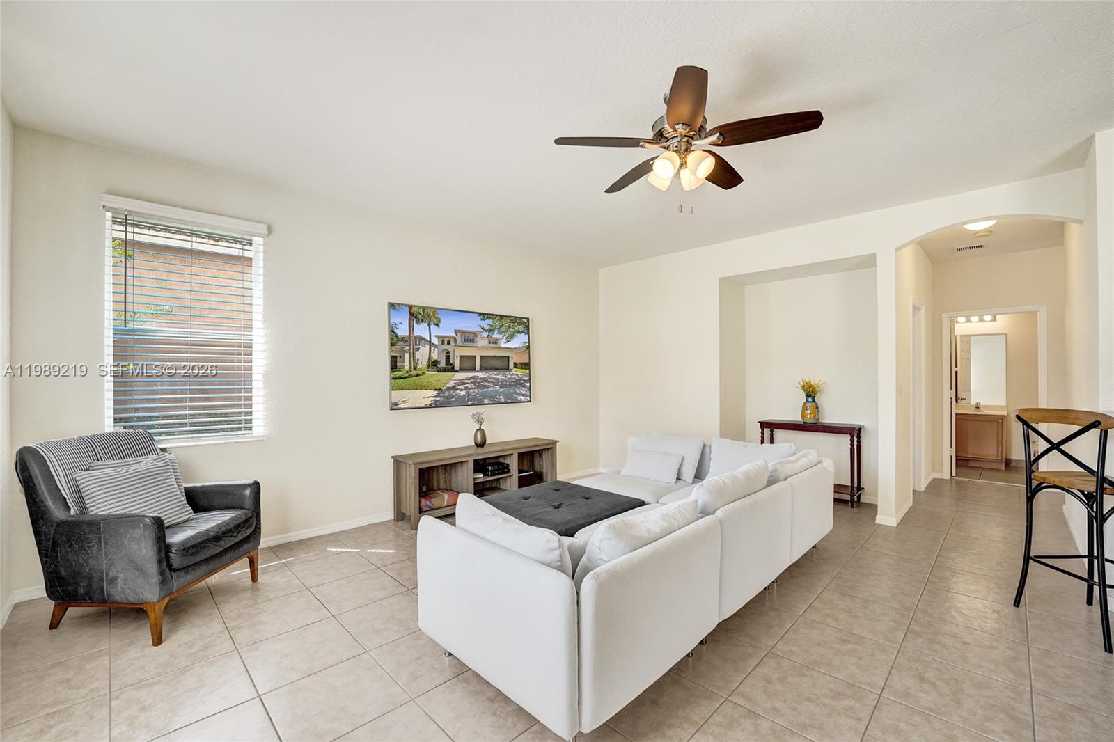 3936 Cascade Terrace Weston, FL 33332 - Photo 23 of 90 a living room with furniture and a window