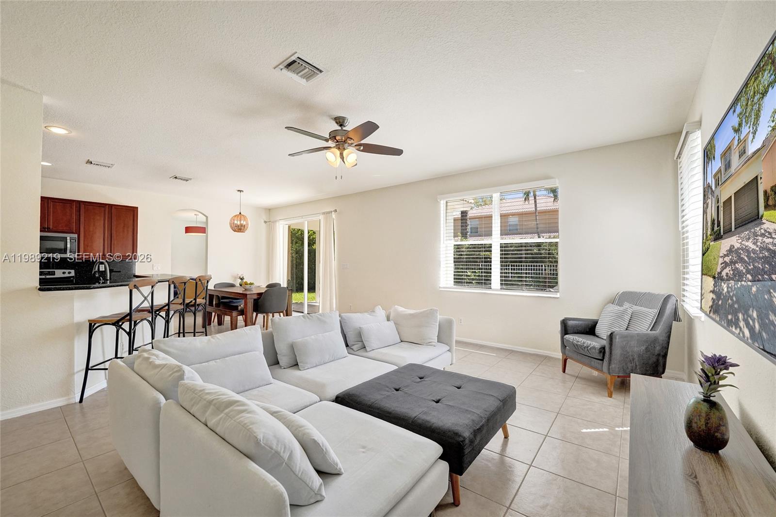 3936 Cascade Terrace Weston, FL 33332 - Photo 25 of 90 a living room with furniture and a window