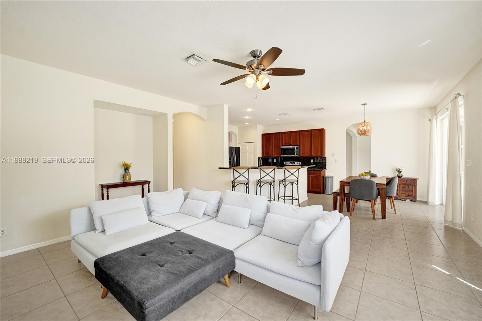 3936 Cascade Terrace Weston, FL 33332 - Photo 27 of 90 a living room with furniture and a flat screen tv