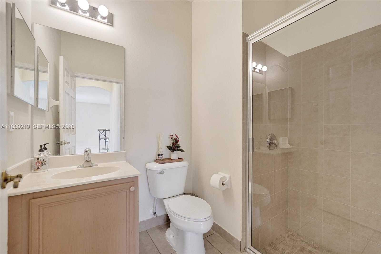 3936 Cascade Terrace Weston, FL 33332 - Photo 31 of 90 a bathroom with a toilet sink and shower