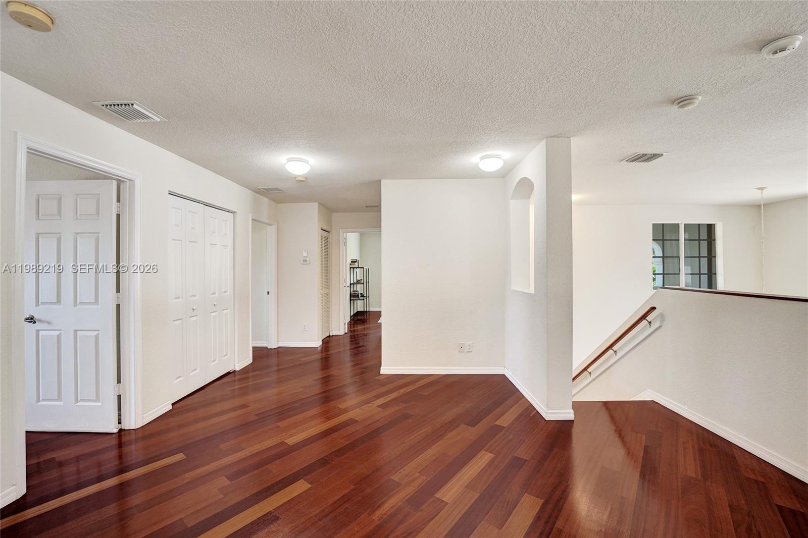 3936 Cascade Terrace Weston, FL 33332 - Photo 39 of 90 a view of an empty room with wooden floor