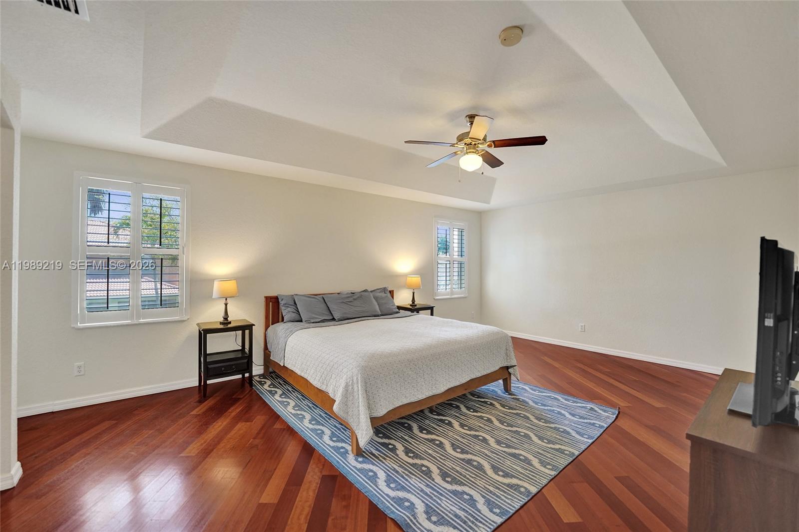 3936 Cascade Terrace Weston, FL 33332 - Photo 43 of 90 a bedroom with a bed window and a flat screen tv