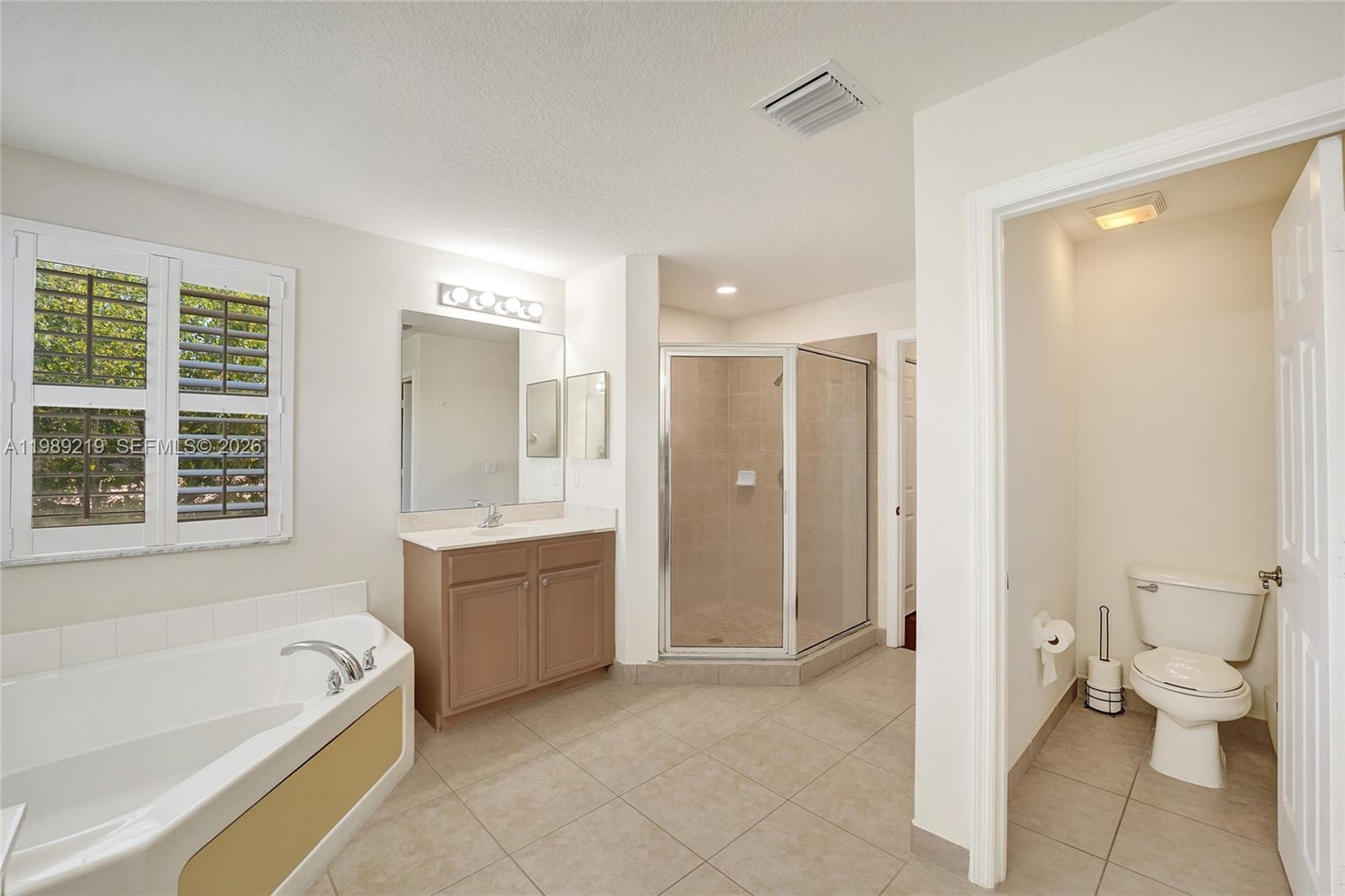 3936 Cascade Terrace Weston, FL 33332 - Photo 50 of 90 a spacious bathroom with a bathtub shower sink and toilet